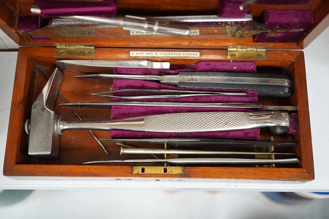 A 19th century mahogany cased surgeon’s set of steel surgical instruments by S. Maw Son & Thompson, London, comprising of an amputation saw, scalpel, a hammer, etc., dimensions of the case; 23.5cm wide, 10.5cm deep, 4cm